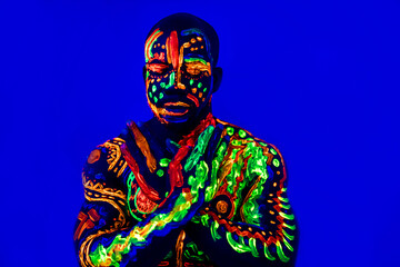 afro american man posing in studio shot with UV light