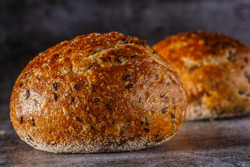 Assortment of baked bread on wooden table background Fresh fragrant bread on the table. Food concept.
