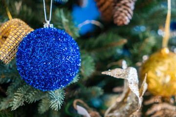 Christmas background, living branches of spruce. Christmas decorations, Santa's mitten Pink and...