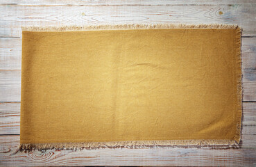burlap napkin, hessian sacking on wooden background