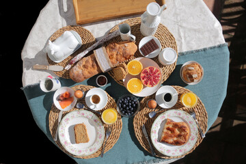 Fototapeta na wymiar breakfast brunch with toast bread coffee tea orange pomegranate salmon