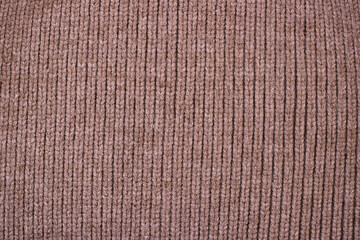 Dark brown knitted wool texture background