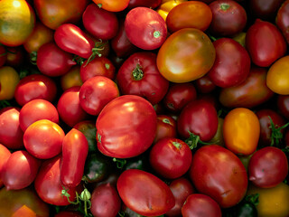 Background with ripe red tomatoes..