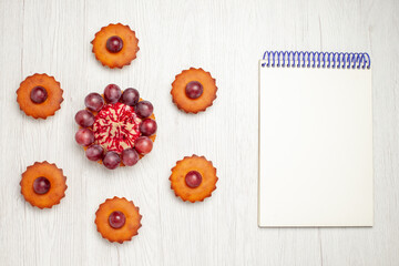 top view delicious cakes with grapes on white desk dessert biscuit pie cookie