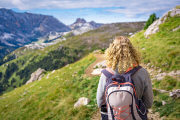 female hiker hiking in the alps