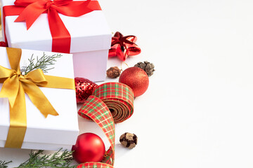 new year concept. gift boxes with ribbon , pine branches and Christmas ornaments. copy space. Christmas decorations