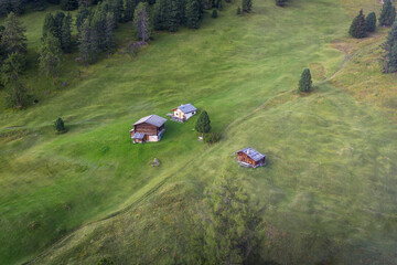 aerial view on wooden houses on the meadow