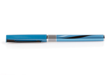 Side view of a blue ballpoint pen, isolated on a white background. Close-up.