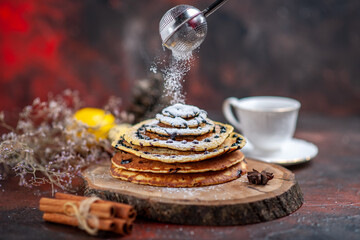 front view tasty sweet pancakes with tea on a dark background milk dessert sweet
