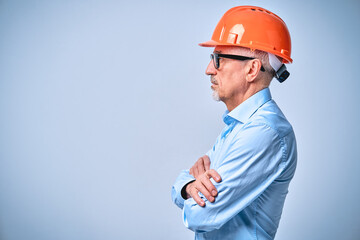 Professional bearded construction worker posing in studio
