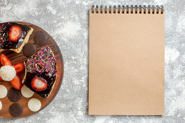 top view delicious cake slices with choco cookies on a white background dessert cake sweet