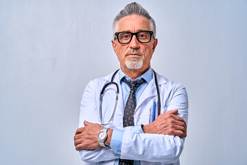 Mature Caucasian doctor wearing a lab coat in studio