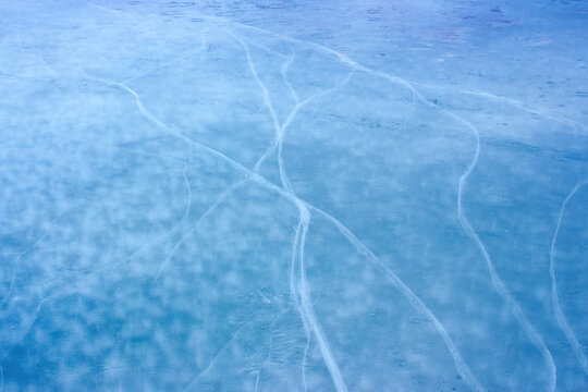 blue ice crack texture. frosty outdoor background in winter