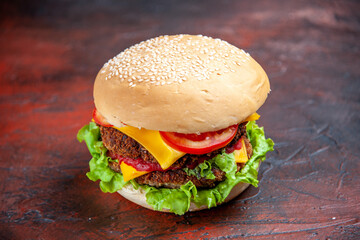 front view tasty meat burger with cheese and salad on dark floor bun sandwich fast-food