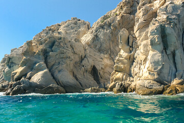 Fototapeta na wymiar Rock island surrounded by beautiful colored sea