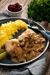 Grilled chicken breast with mushroom sauce.