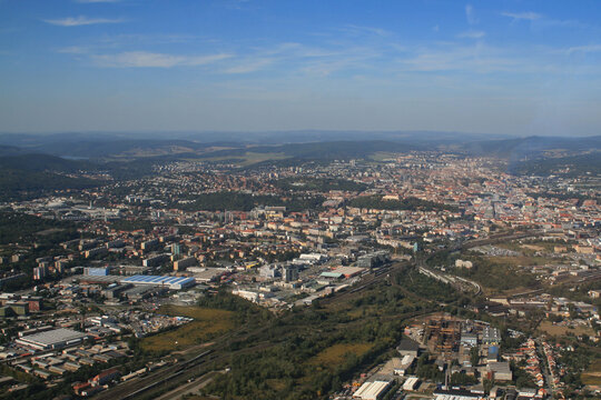 View from the plane on the city of Brno in the Czech Republic in Europe. In the background is a blue sky with white clouds. © Roman Bjuty