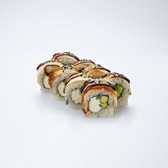 Japanese cuisine. Sushi roll with smoked eel on white background.