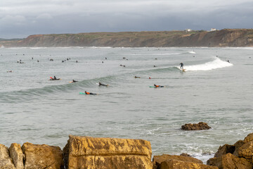 surfers enjoy a day of surfing at Baleal north beach in Portugal