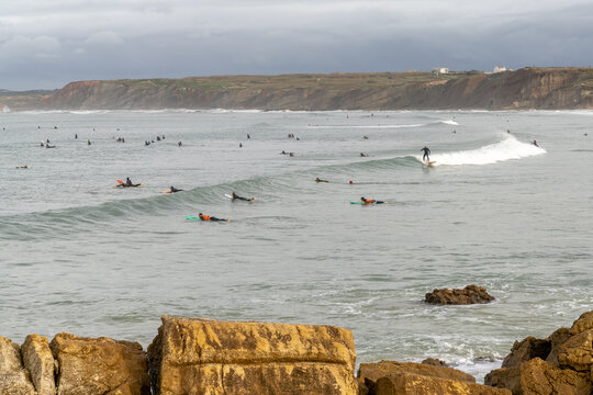 surfers enjoy a day of surfing at Baleal north beach in Portugal