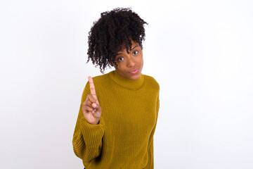 No sign gesture. Closeup portrait unhappy Young beautiful African American woman wearing knitted...