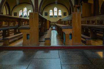 Empty benches in a church, empty prayer benches in a church