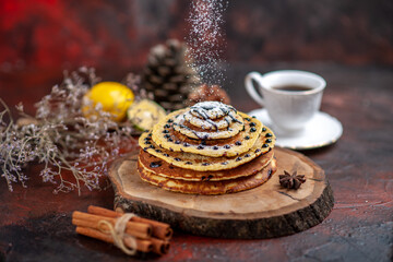 top view yummy sweet pancakes with tea on dark floor dessert milk sweet