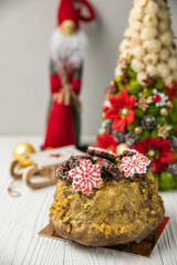 Christmas cupcake on a white wooden table.
