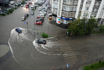 Heavy rains caused flooding on the city's roads.