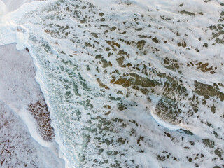 aerial drone photo of the sea at Holywell bay cornwall England uk where poldark is filmed 