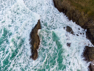 aerial drone photo of the sea at Holywell bay cornwall England uk where poldark is filmed 