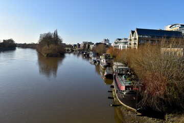 Obraz premium traditional UK river boats by the side of Thames river