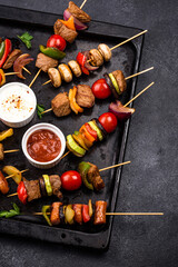 Grilled kebabs with meat, mushrooms and vegetables