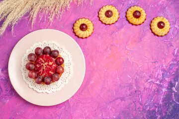 top view little cookies with cake on pink background biscuit cake sweet dessert