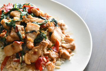 Stir fried pork belly basil with rice.  Thai popular food. Cooked to order dish. 