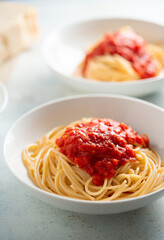Spaghetti with tomato sauce and basil on a plate