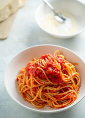 Spaghetti with tomato sauce and basil on a plate