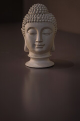 Sculpture of a bust of a Buddha. Eastern god in Buddhism. India and Sri Lanka beliefs