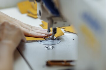 sewing machine scribbling fabric. tailoring at the factory