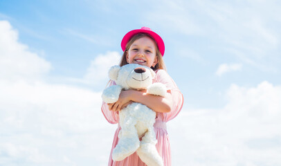 Excitement. teddy bear shop. toy shop for kids. happy childrens day. childhood happiness. little cheerful child with present. fluffy and cute gift. happy birthday. small girl play with bear toy