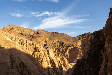 Fototapeta na wymiar Coloured Canyon in Dahab on South Sinai (Egypt) peninsula. Desert rocks of multicolored sandstone background..