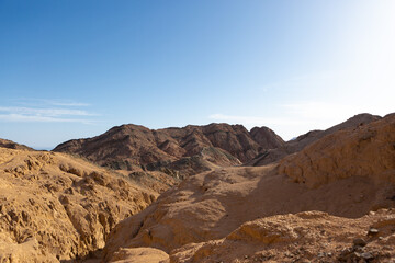 Coloured Canyon in Dahab on South Sinai (Egypt) peninsula. Desert rocks of multicolored sandstone background..