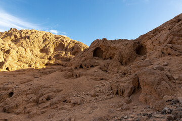 Fototapeta na wymiar Coloured Canyon in Dahab on South Sinai (Egypt) peninsula. Desert rocks of multicolored sandstone background..