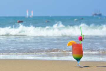 Exotic summer cocktail drinks on a beach. Summer holiday and relaxing. Beach with sand and palms. Vacation in paradise concept. Tropical resort.