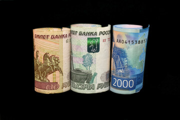 Russian rubles bills. Russian ruble plunges, crashing. Rus rubles crisis. Russian ruble is going down or growing up.