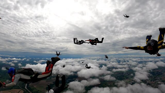 Wonderful sky with many parachutists at the end of a jump in separation. 4K resolution and  59,94 fps.