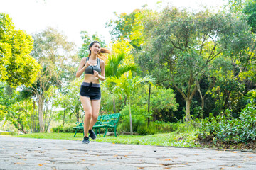 Fitness sport two slim fit and fat girls in fashion sportswear running in garden morning, outdoor...