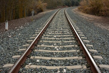 Fototapeta na wymiar Vista de una vía y traviesas de un tren convencional