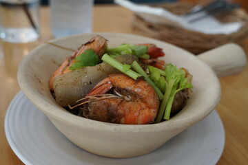 The Asian style baked tiger prawns in the hot clay pot with some gingers and Chinese celery. Spicy grass noodle with the seafood dish.