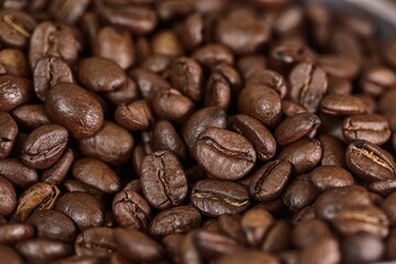 Coffee beans pile background closeup